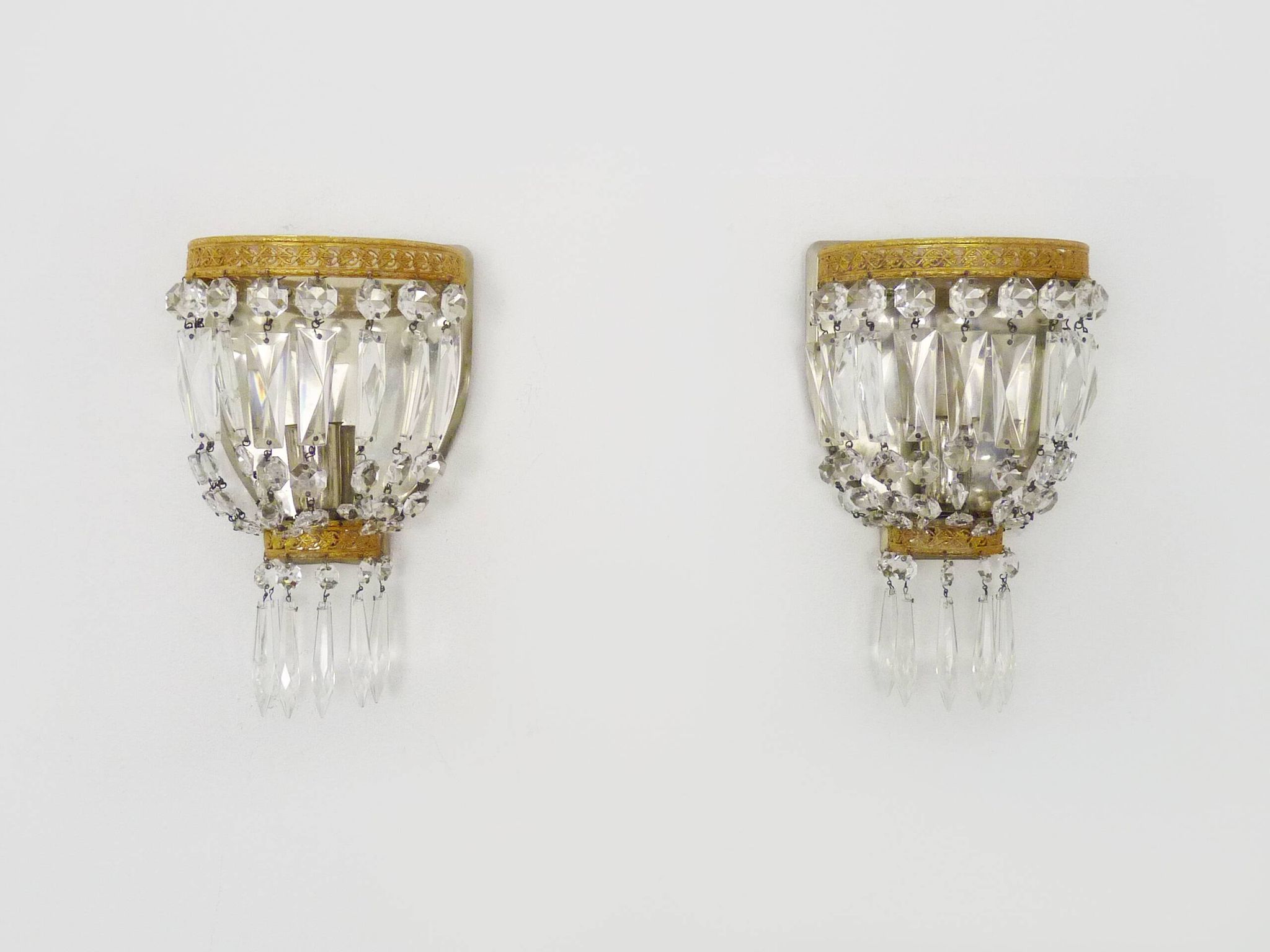 Pair of vintage bronze basket wall lights with glass pendants. The 50's