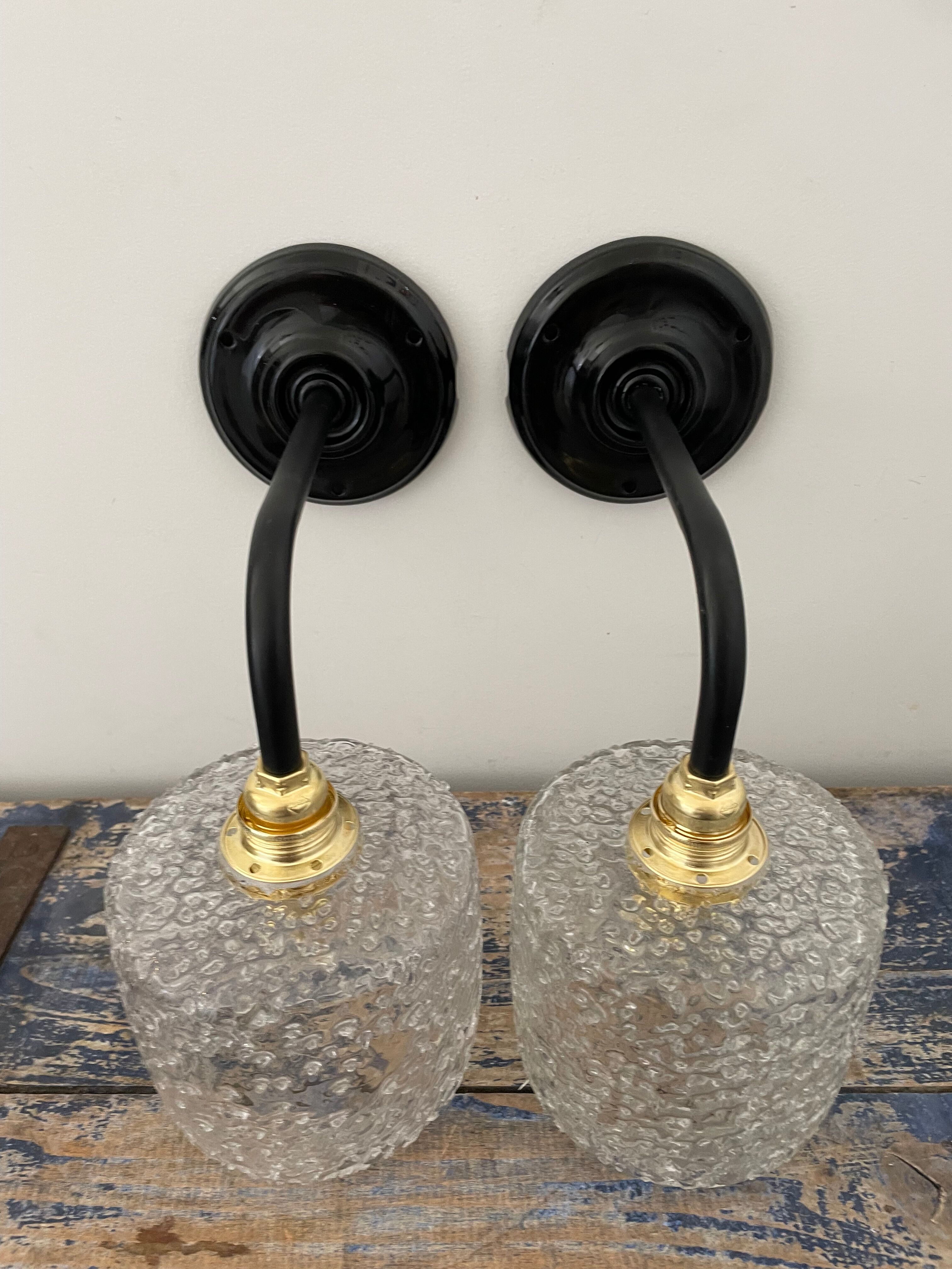 Set of two chiseled glass sconces