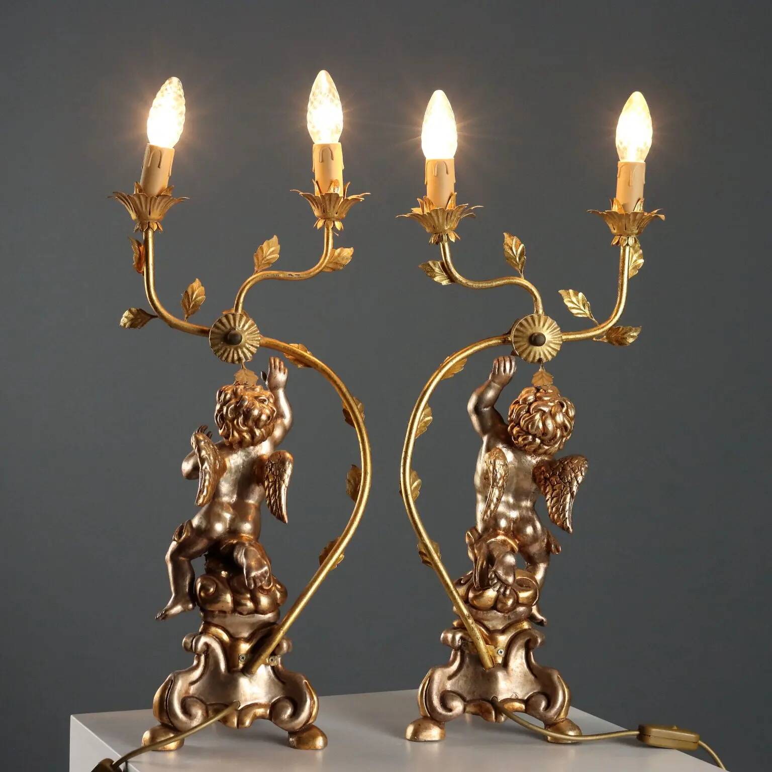 Pair of antique candelabra in carved and gilded wood, Italy, 20th century