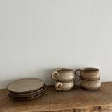 4 stoneware coffee cups and saucers