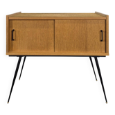 Modernist sideboard with 2 doors in oak veneer.
