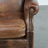 Warm, cosy and comfortable vintage sheepskin ear armchair with character