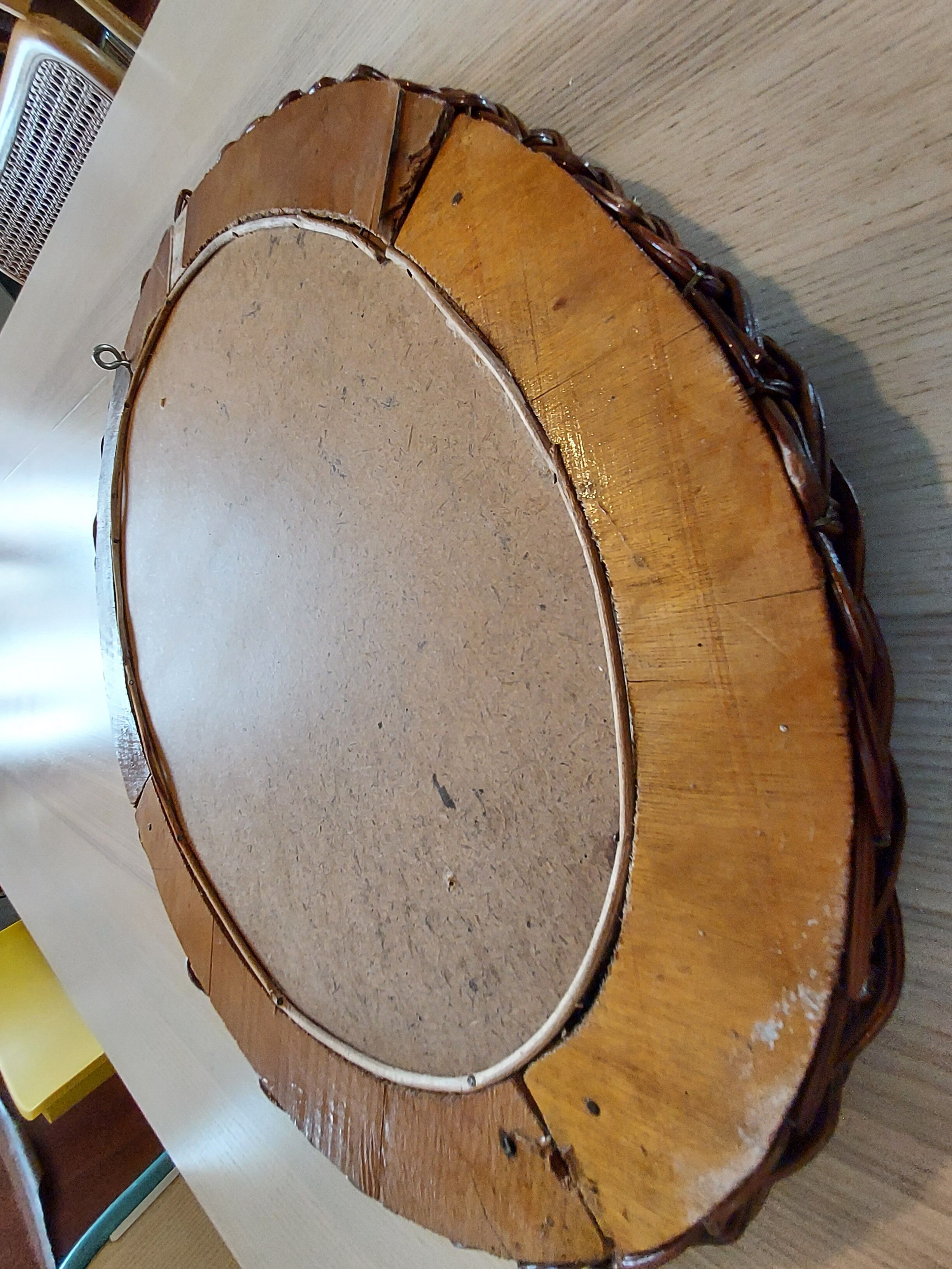 Oval mirror in dark rattan