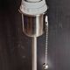 Modern white nickel lamp base with pull switch.