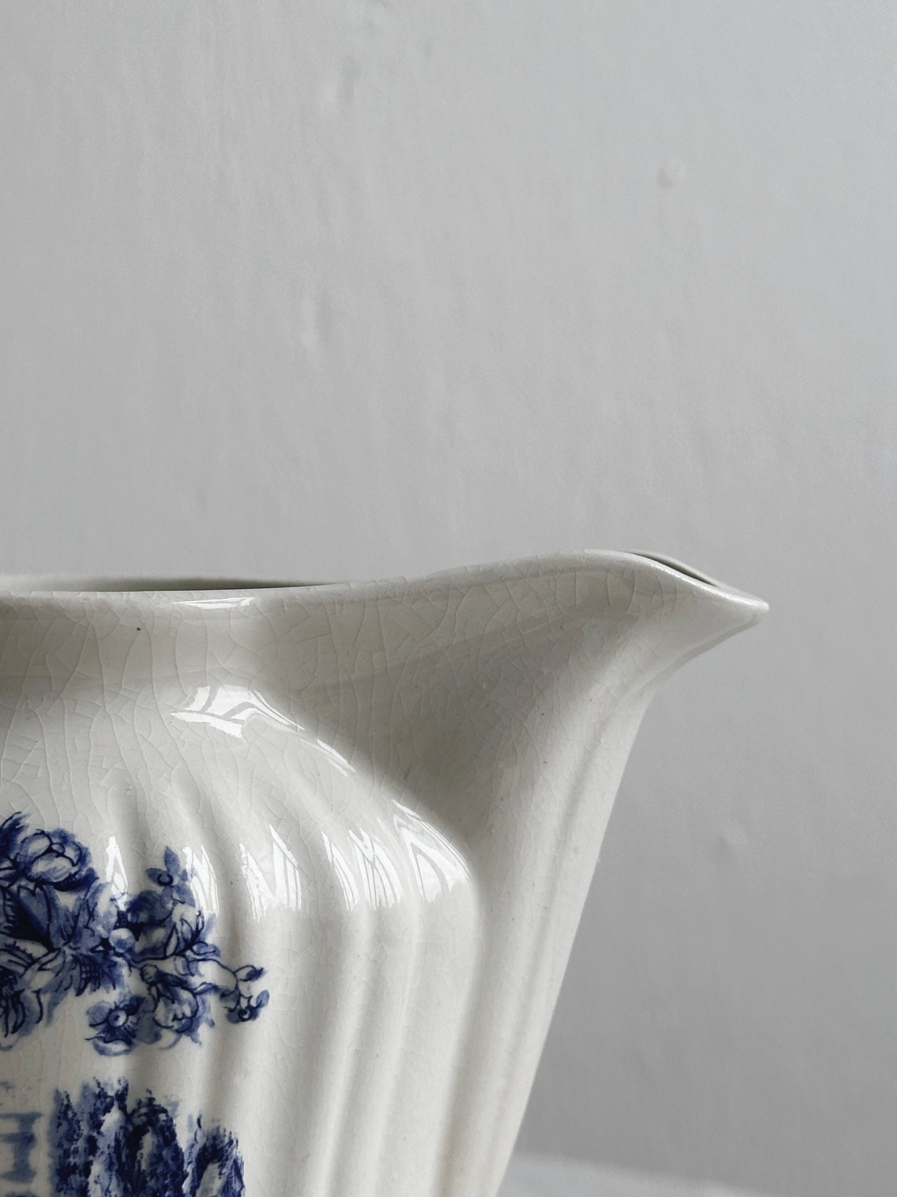 Porcelain sauce boat with blue pastoral pattern