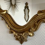 Old baroque style wall mirror with golden moldings