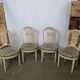 5 chaises en bois laqué blanc style Louis XVI