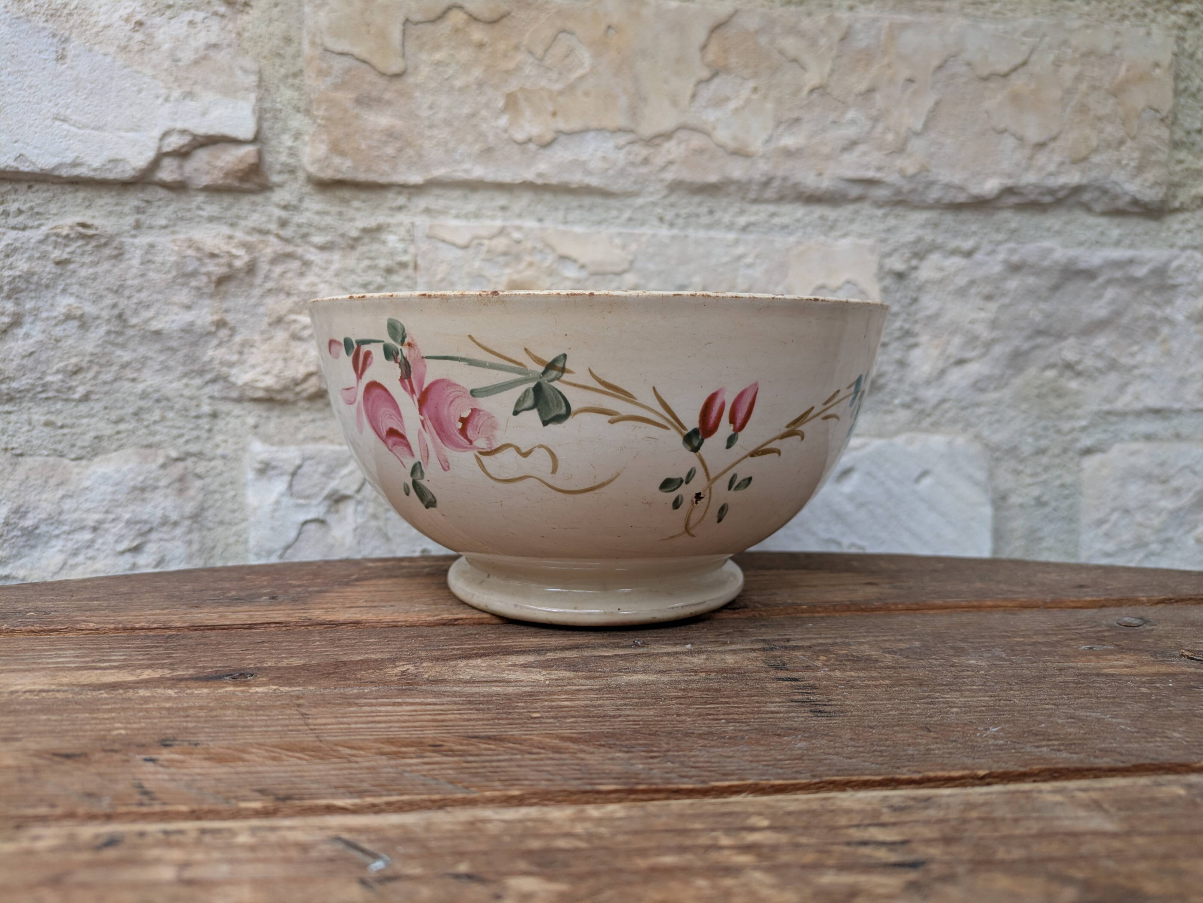 Old opaque porcelain bowl from Gien with a floral decoration.