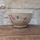 Old opaque porcelain bowl from Gien with a floral decoration.