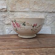 Old opaque porcelain bowl from Gien with a floral decoration.