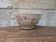 Old opaque porcelain bowl from Gien with a floral decoration.