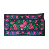 Handwoven floral wool rug, black background with pink roses