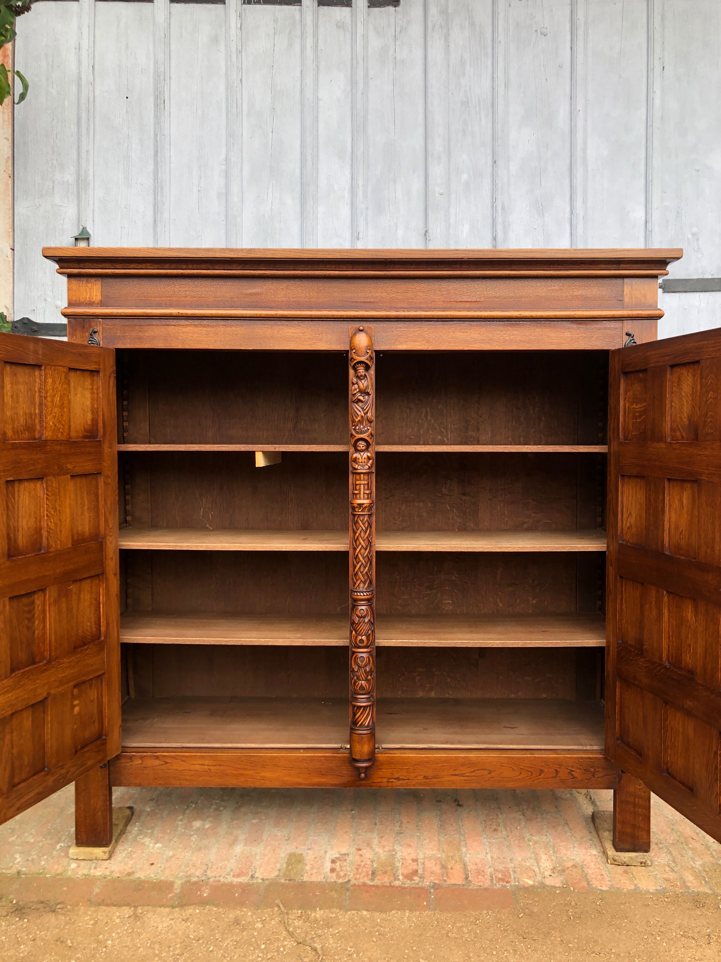 Spanish furniture with carved wood profiles and coats of arms from the 1950s.