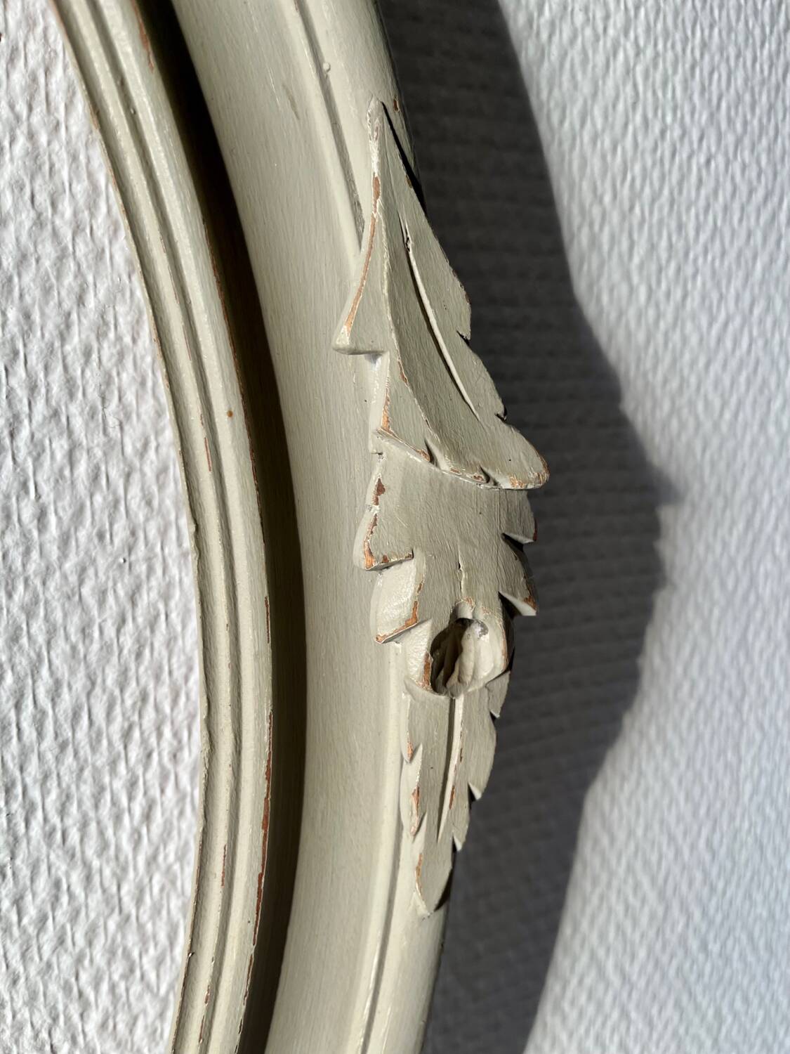 Oval frame in weathered wood