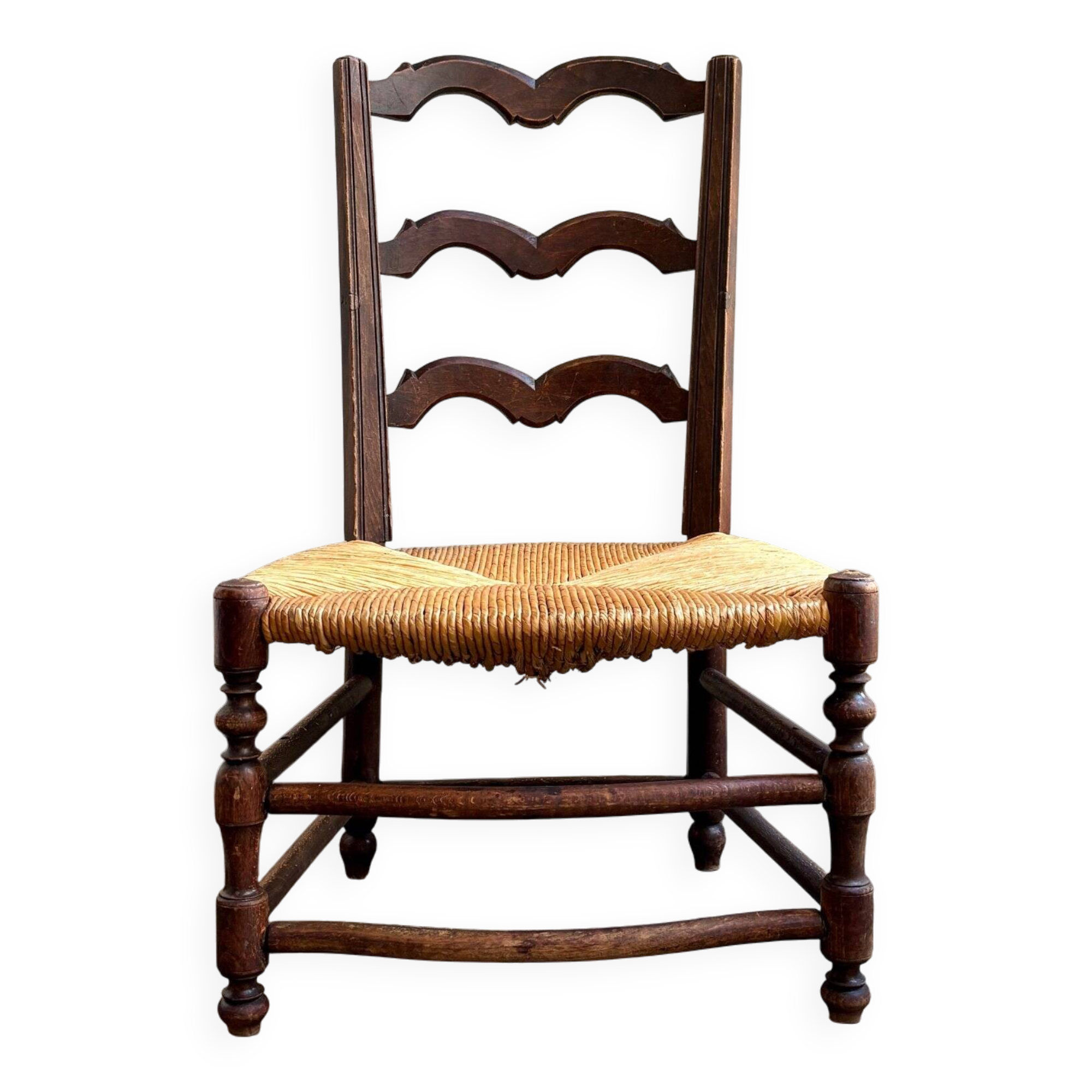 Low Provencal chair in dark wood and woven straw