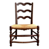 Low Provencal chair in dark wood and woven straw