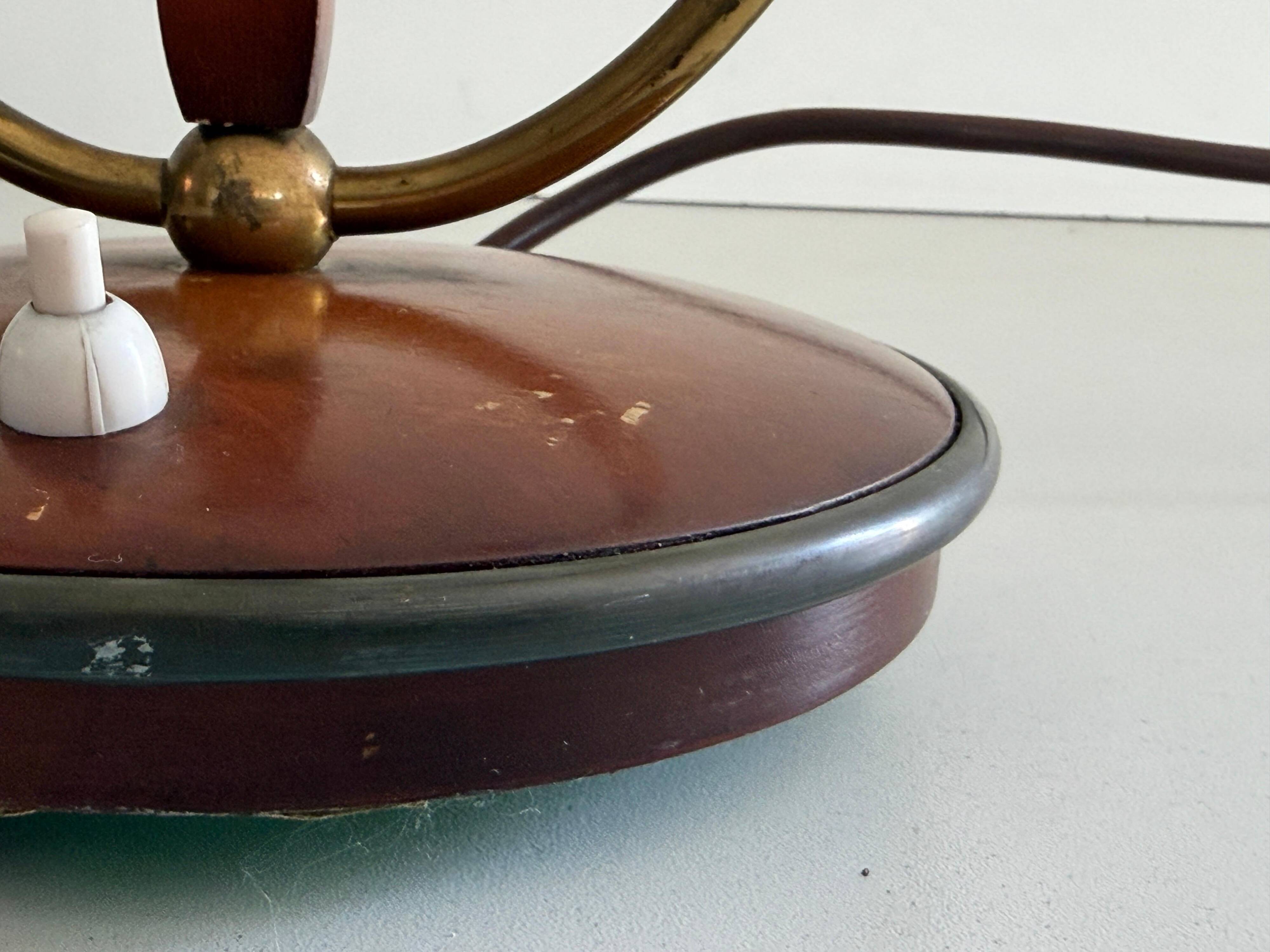 Simple double-headed table lamp in wood and brass, 1960s, Germany.
