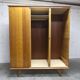 French wardrobe with tapered legs, 3 doors, 1 mirror (27*130), and 1 drawer.