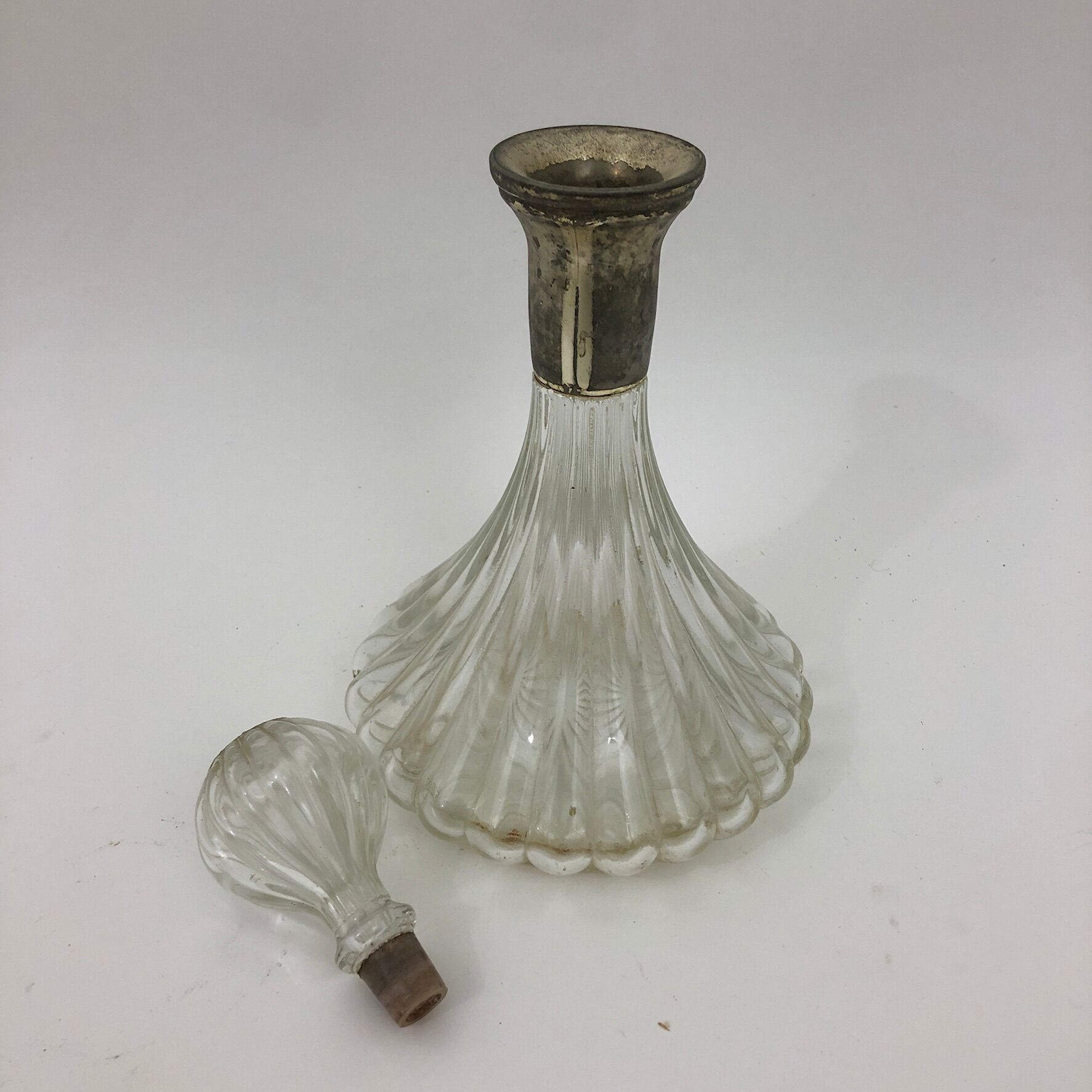 Large glass decanter and tin ring