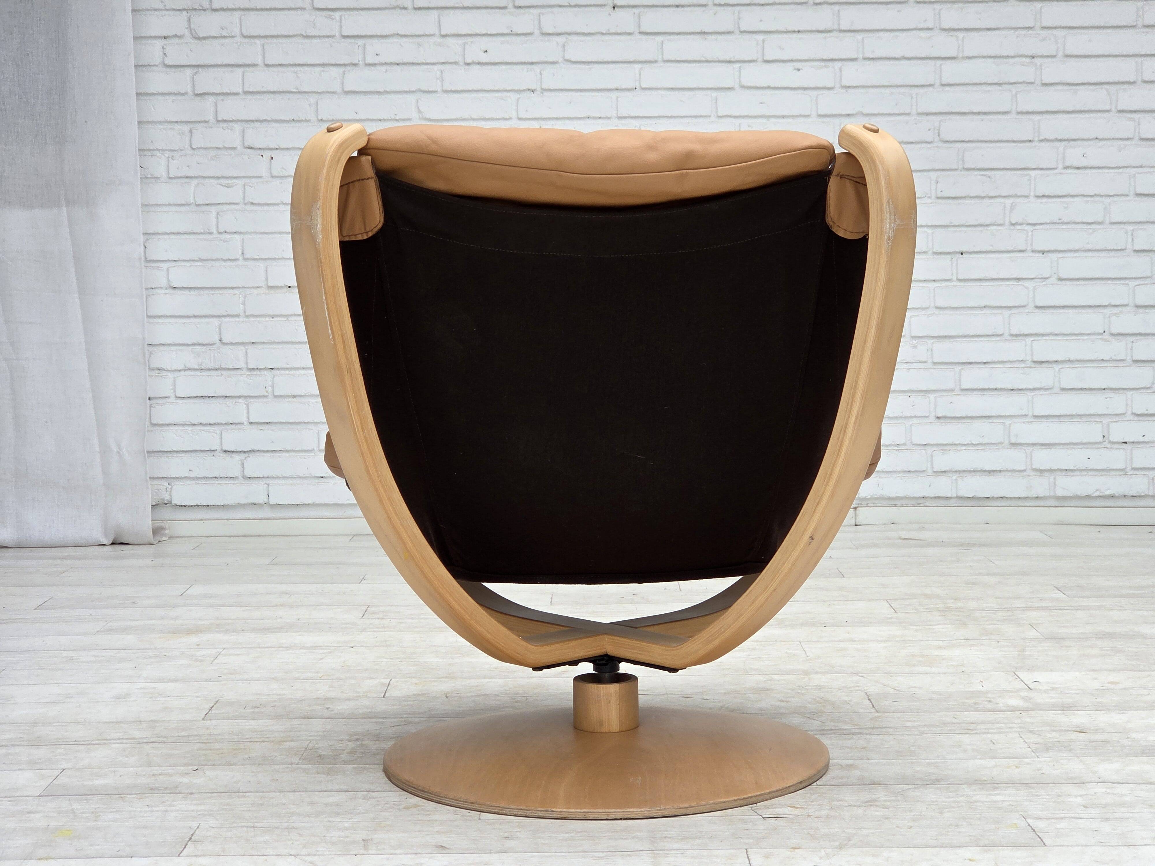 1980s, Scandinavian swivel armchair, furniture leather, bent wood.