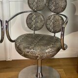 Pair of italian swivel armchairs in chrome-plated metal and piton imitation fabrics