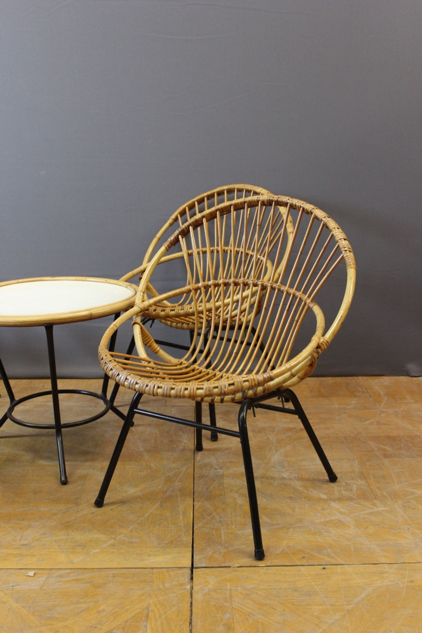 Living room in rattan and black lacquered iron by Rohe Noordwole circa 1950