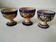Set of three Moroccan ceramic egg cups from Fez, stamped.