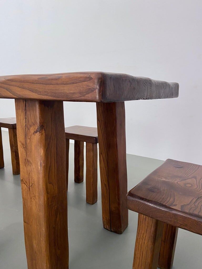 Solid elm dining set including 6 stools France 1970s