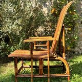 Ancienne chaise longue en rotin et osier, vers 1930