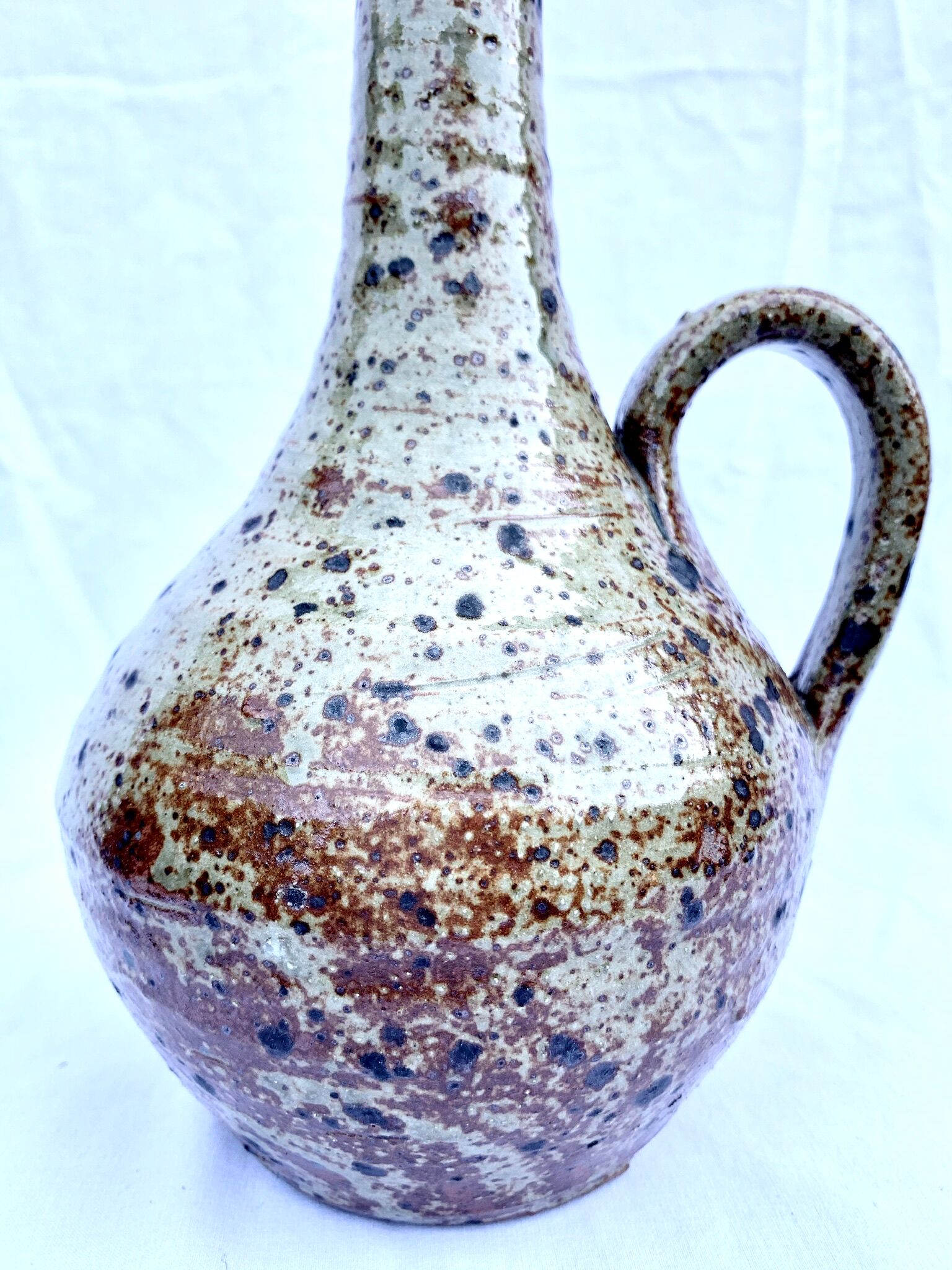 Speckled enamelled sandstone pitcher
