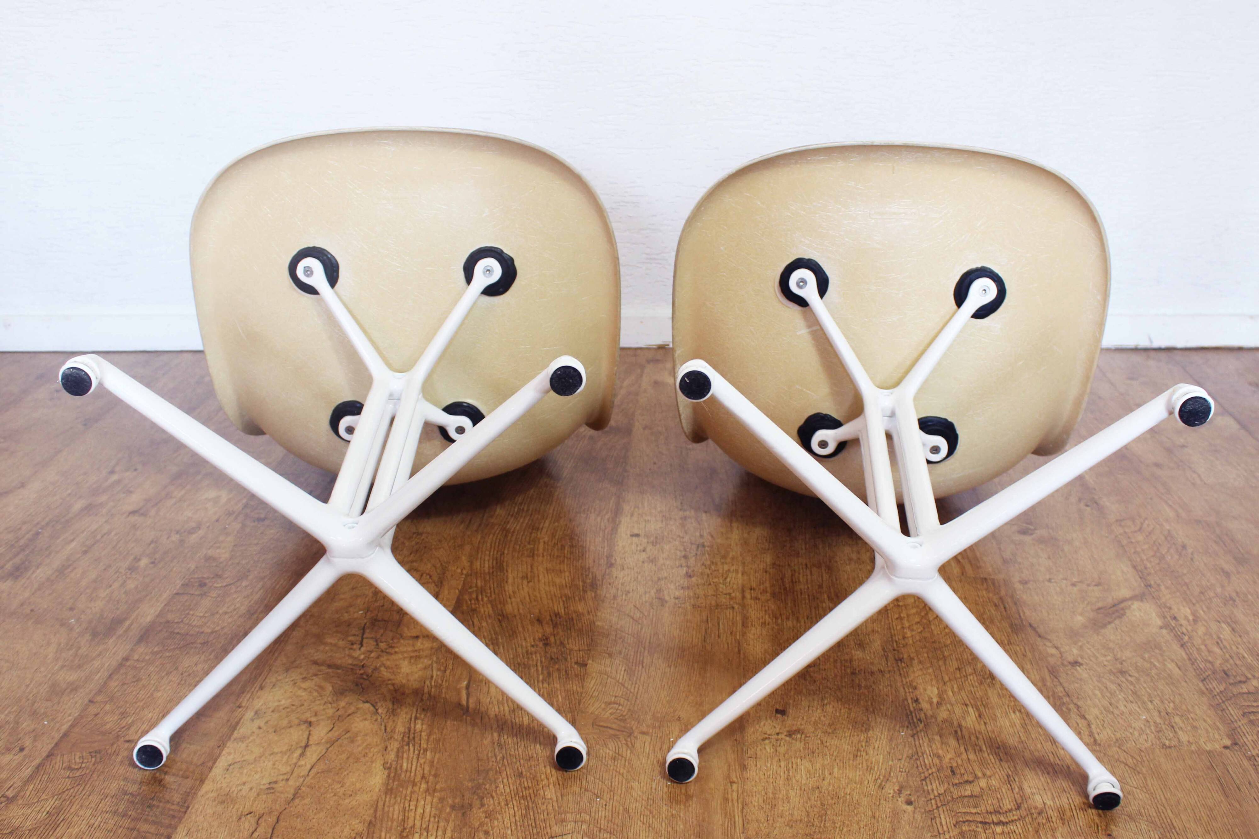 Pair of EAMES La Fonda fiberglass chairs 1970