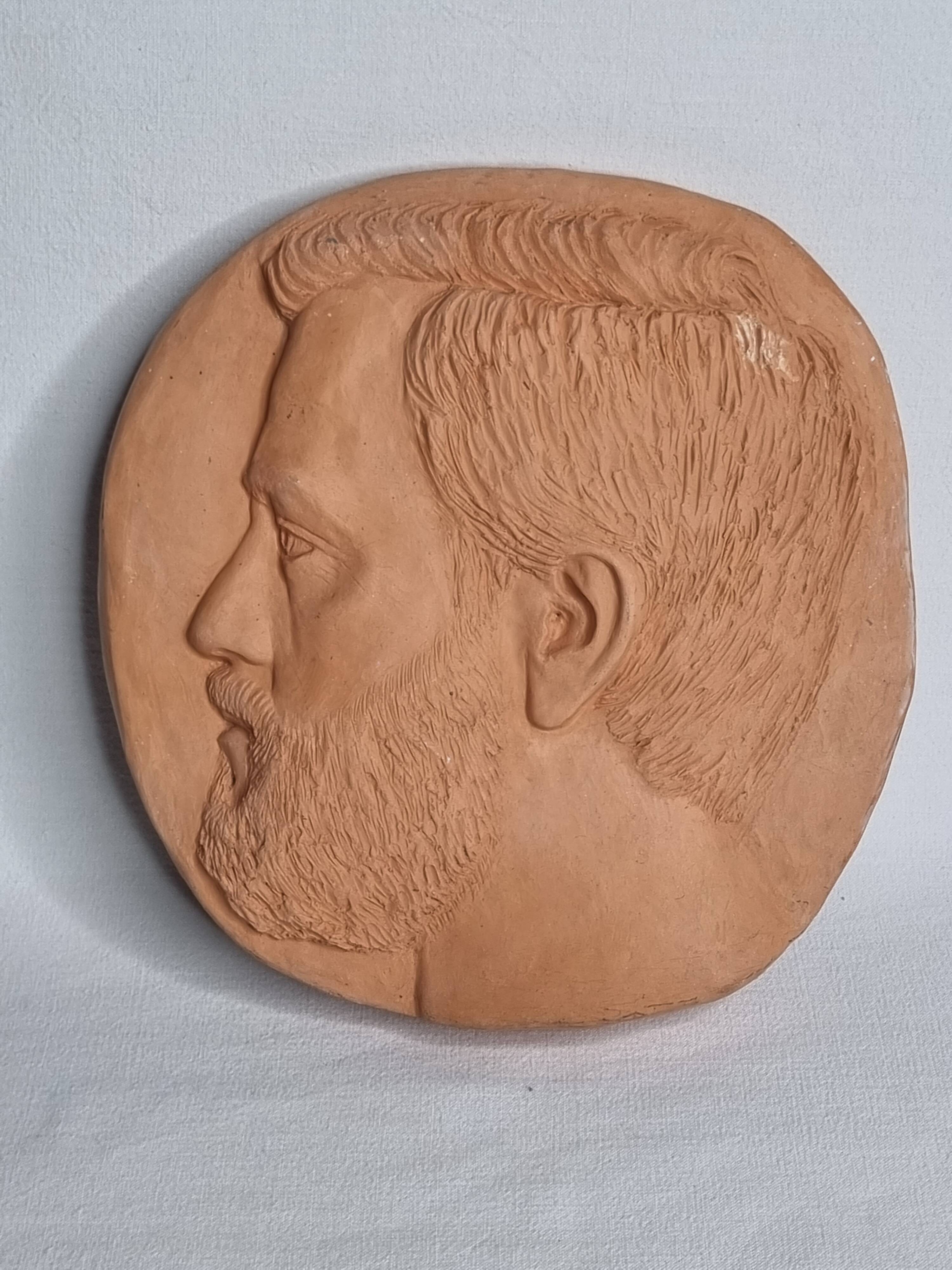 Bas-relief mural in terracotta, profile of a man, signed, 21 x 20 cm, 1984.