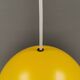 Spherical pendant lamp in sunny yellow.