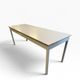 Vintage industrial table with a Formica top and wooden accents.
