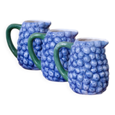 Vintage trio of myrtle blue ceramic jugs.