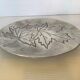 Silver tray with maple leaves in stainless steel.