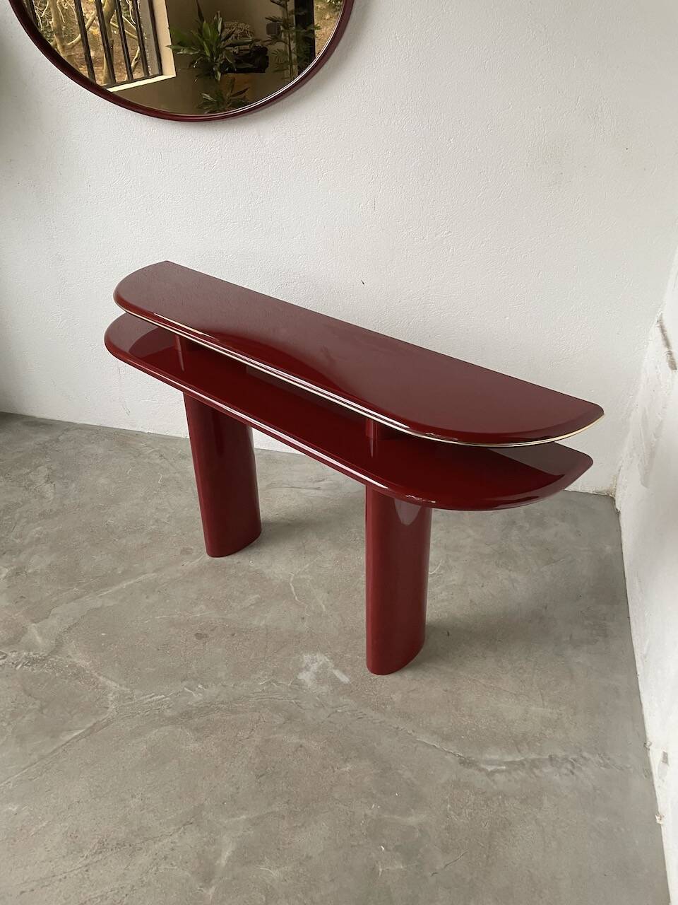 Red lacquered console and its mirror from the 80s
