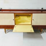 Vintage row in lacquered wood and formica