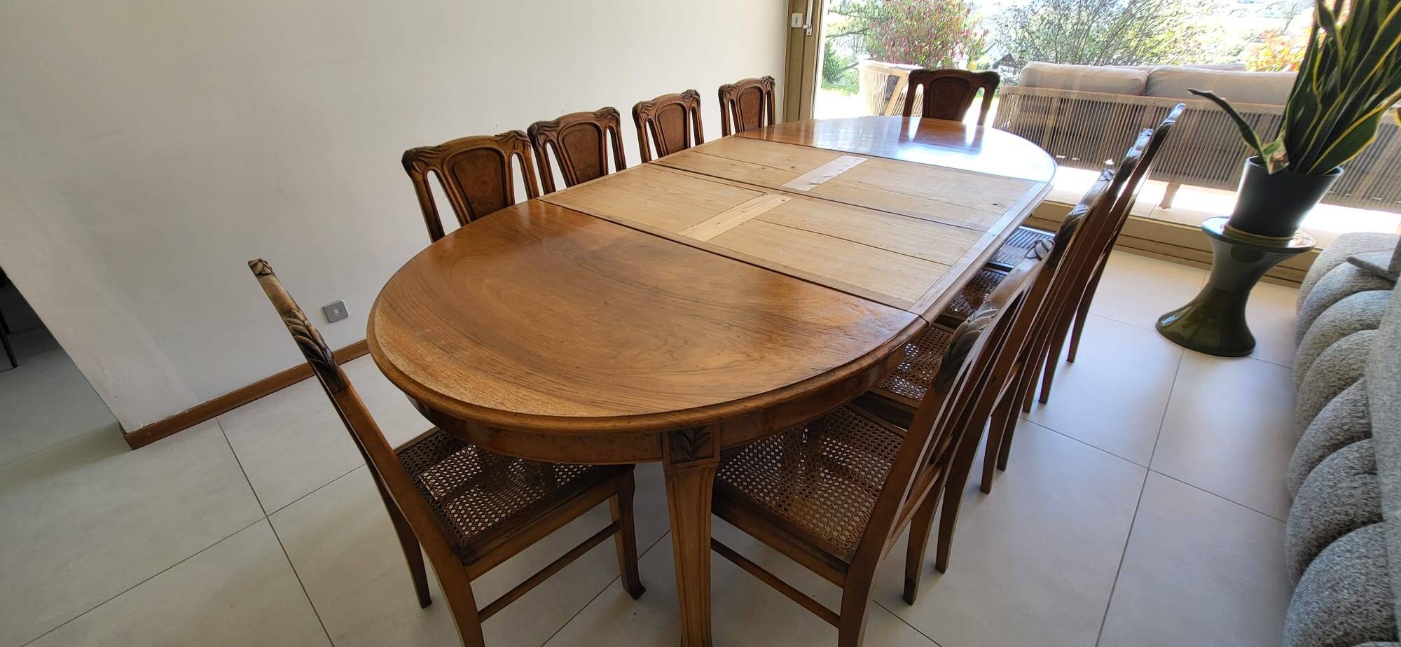 Table and 10 Art Nouveau style chairs.