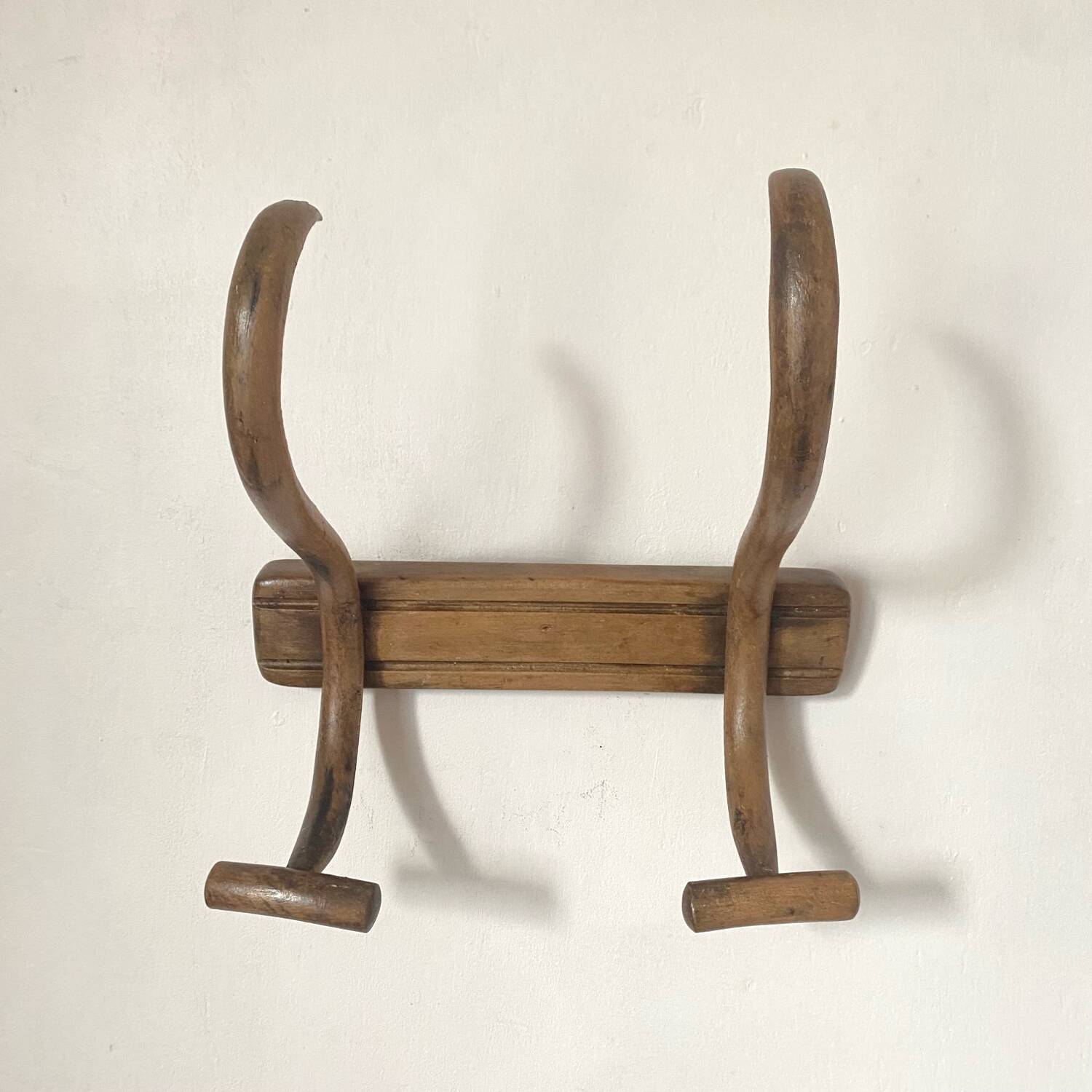Curved wooden coat rack from the early 20th century