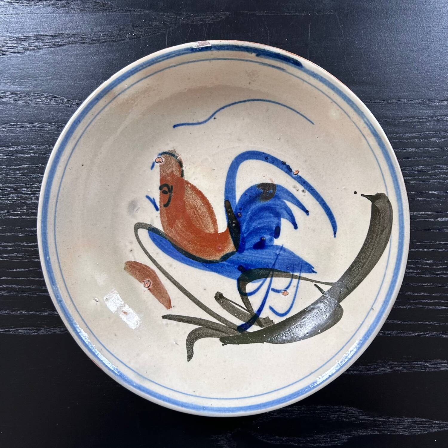 Antique dish with bird decoration