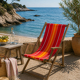 Vintage deck chair with red and orange striped fabric, original patina.