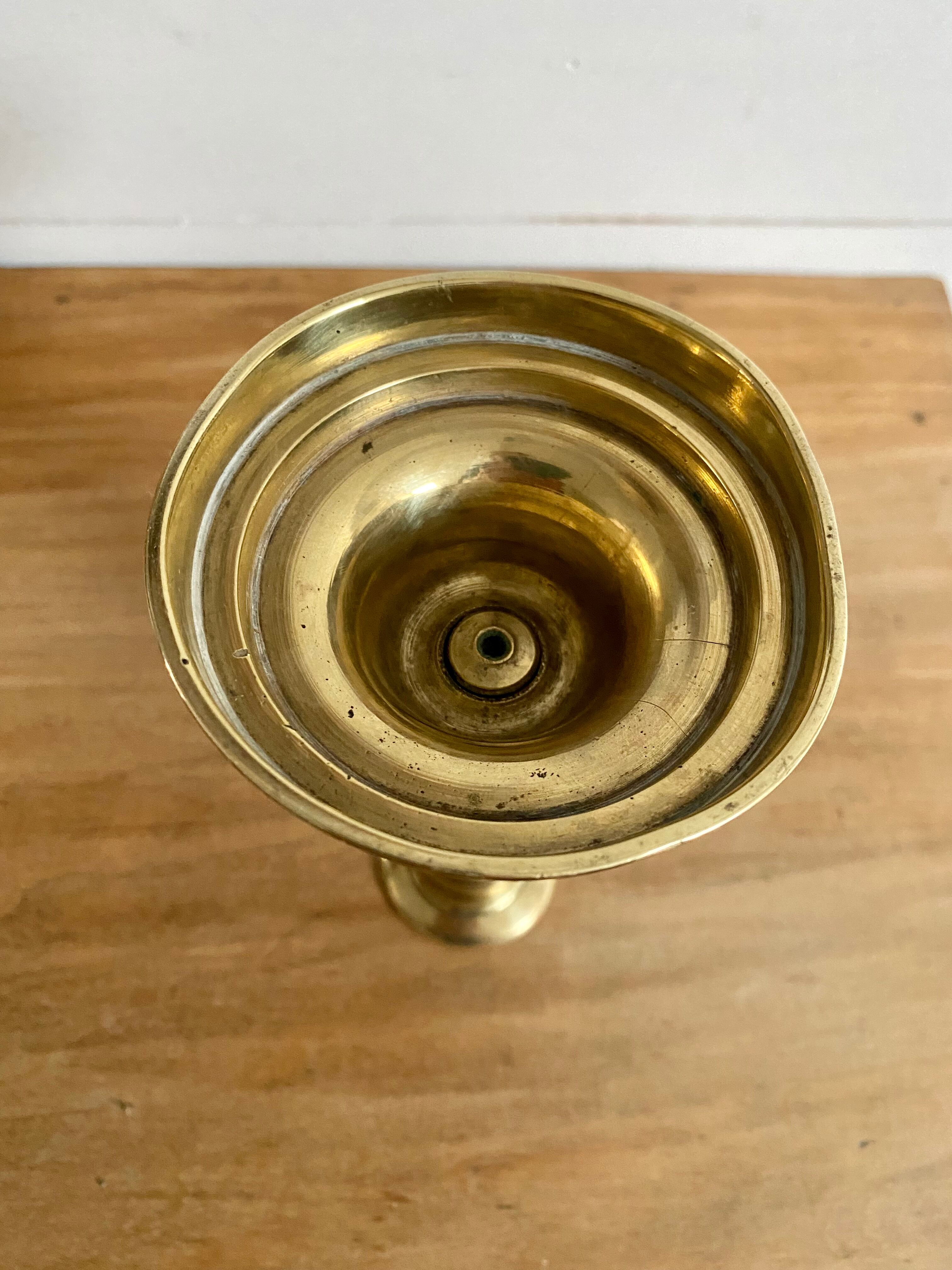 Nineteenth-century brass pull-out candle holder