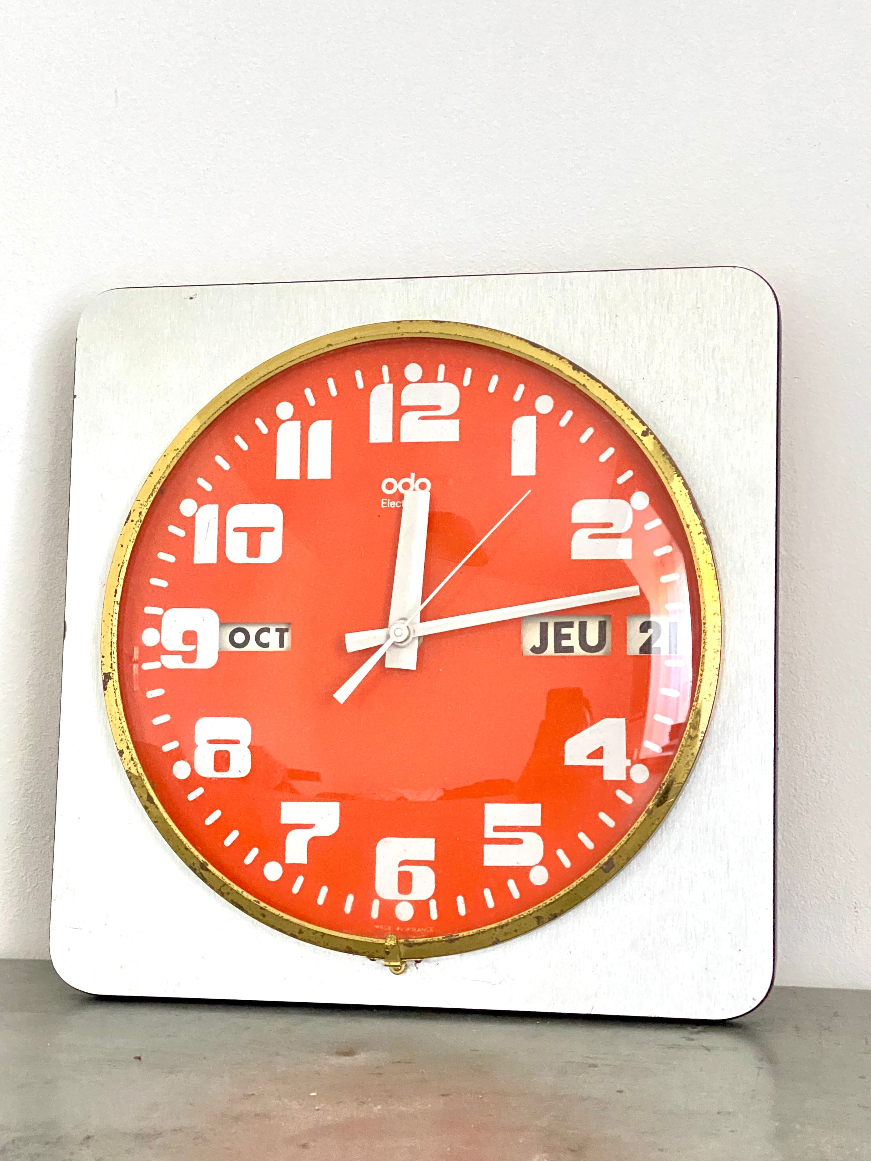 Vintage orange wall clock