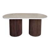 Oval coffee table in travertine and fluted wood.
