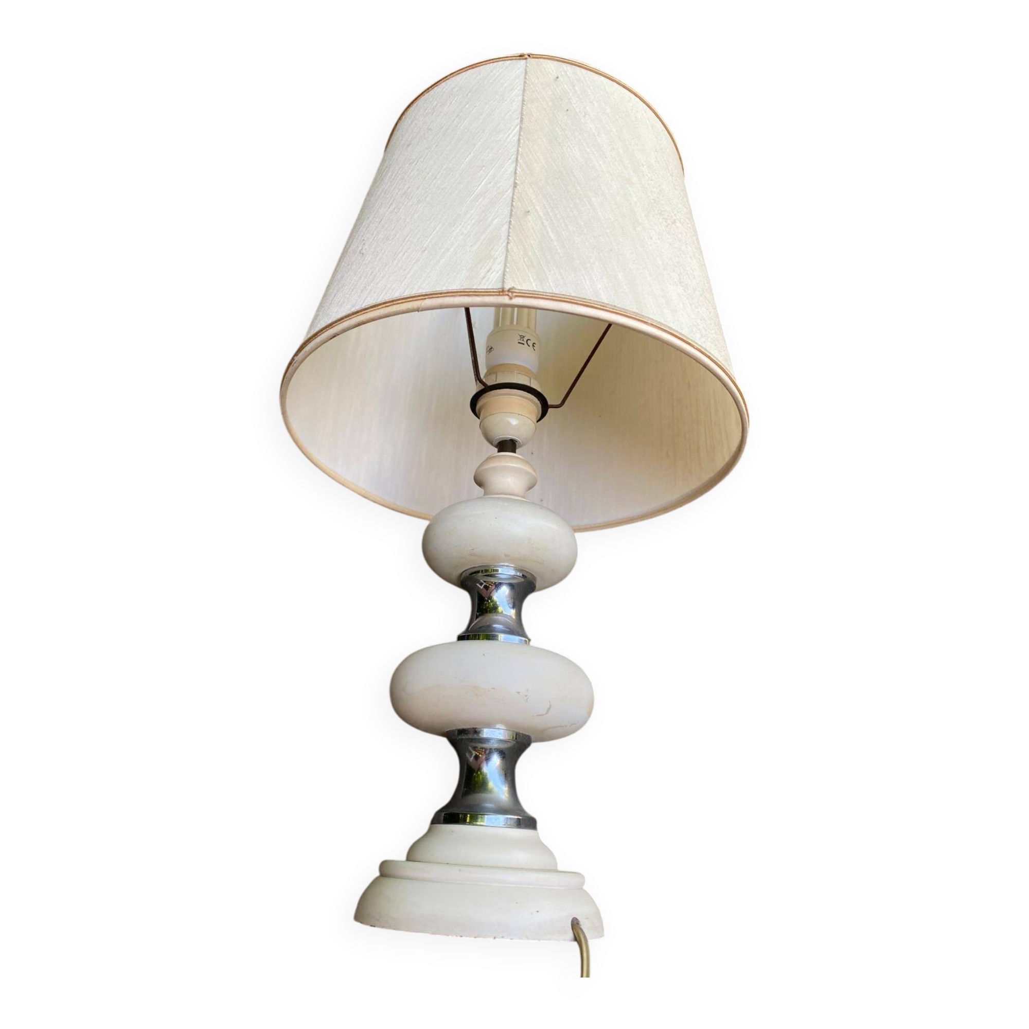 Space age bedside lamp in off-white wood with a metal band.