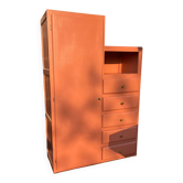 Asymmetrical vintage wardrobe painted in terracotta.