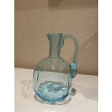 Blue carafe with vintage button