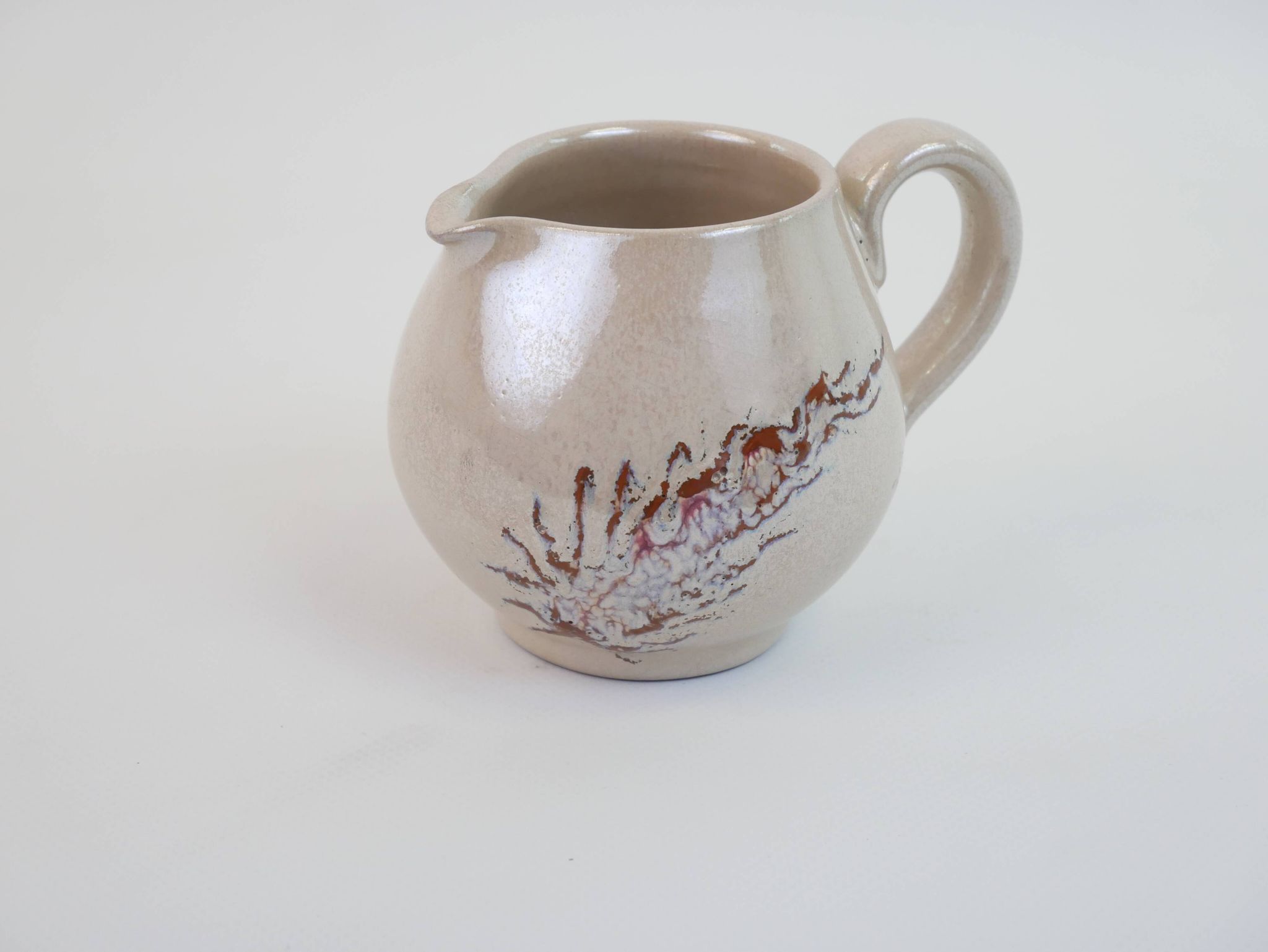 Pair of ceramic milk jugs signed La Roue Vallauris
