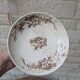 Flat serving compote dish in Terre de Fer HB & Cie with brown floral decoration.